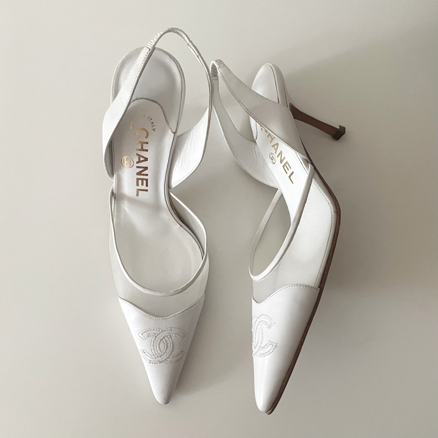 Chanel “CC” White Leather Slingback Heels