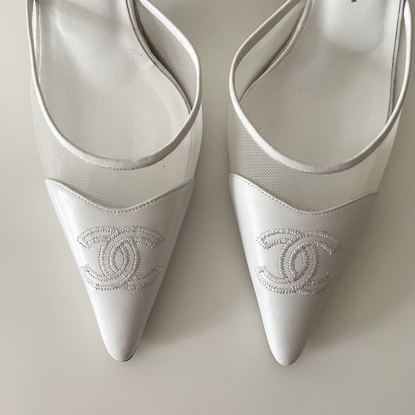 Chanel “CC” White Leather Slingback Heels
