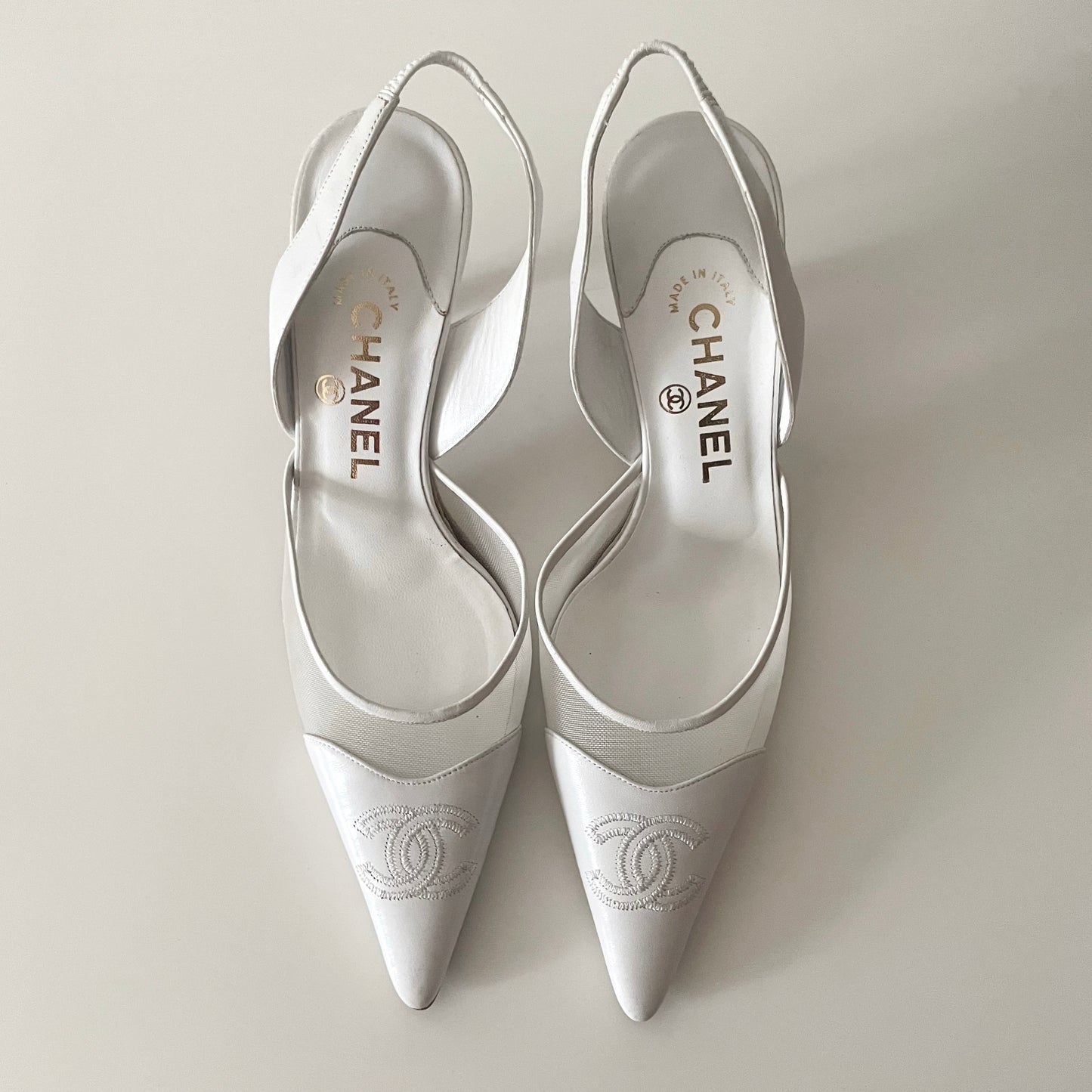 Chanel “CC” White Leather Slingback Heels