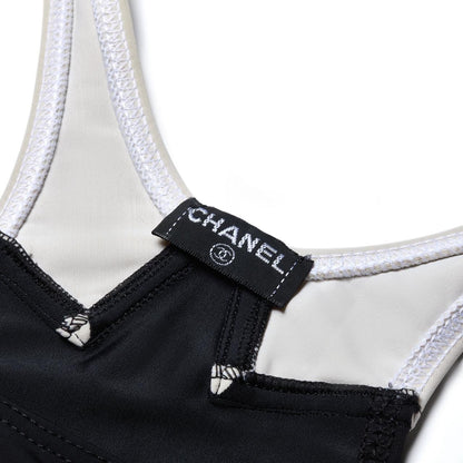 CHANEL 1996 “CC” Cruise Black Dress